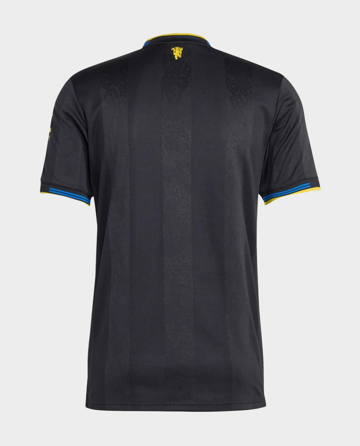 The Dribble Store black back view Manchester United 2025-26 third jersey with blue and yellow sleeve trim and subtle pattern