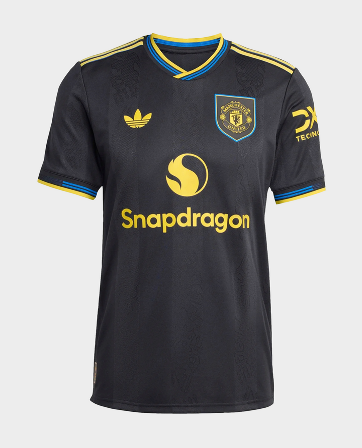 The Dribble Store Manchester United 2025-26 third jersey black with club crest and yellow Snapdragon sponsor logo blue yellow trim