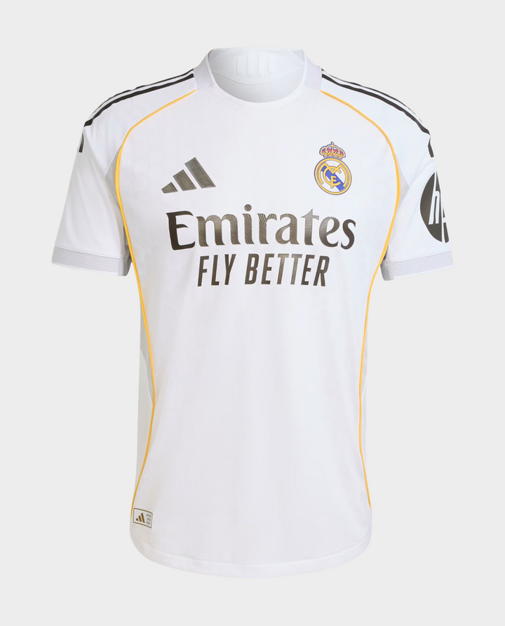 The Dribble Store Real Madrid 2025 home jersey white with gold piping Adidas logo and Emirates Fly Better sponsor