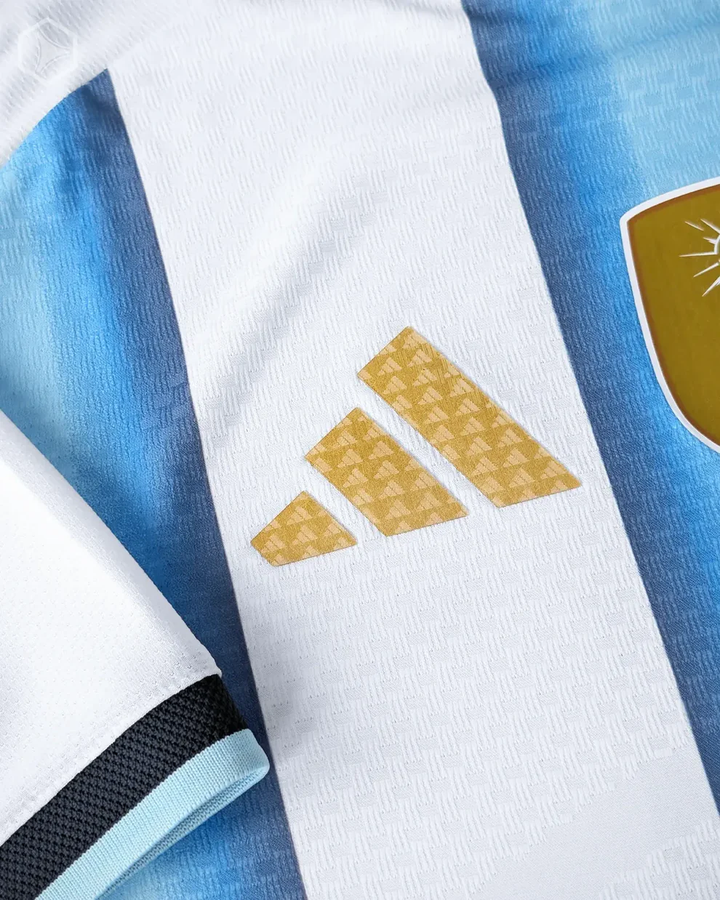 Argentina home jersey 2025 26 featuring the Adidas logo and blue and white stripes