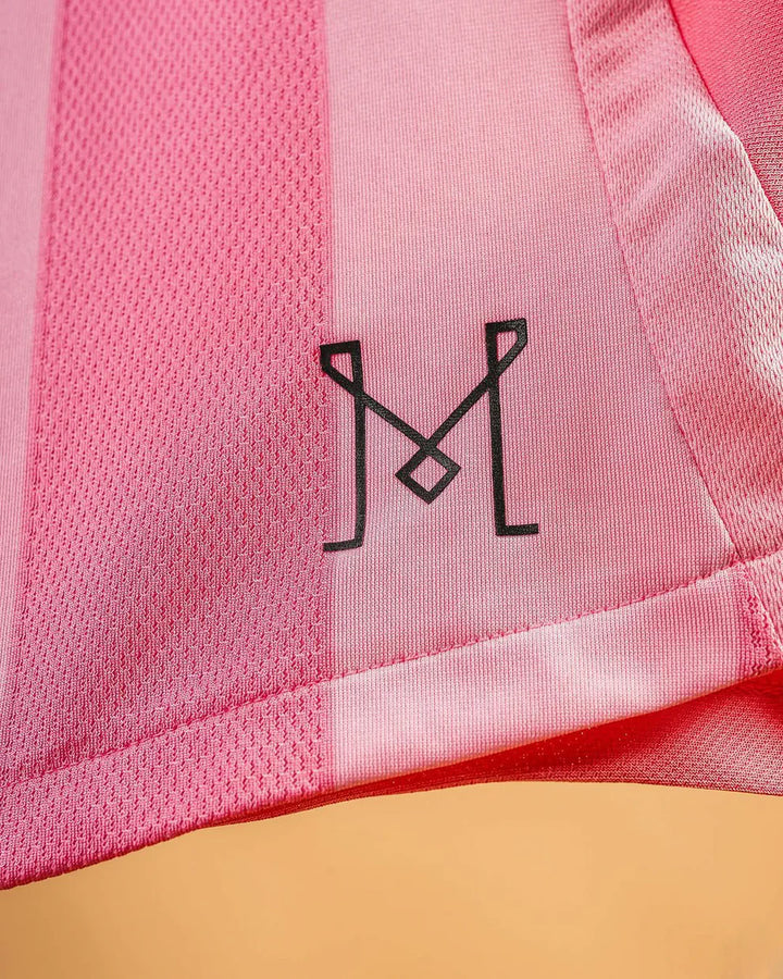 Close-up of the Inter Miami home jersey 2024 featuring the stylish logo detail on soft pink fabric
