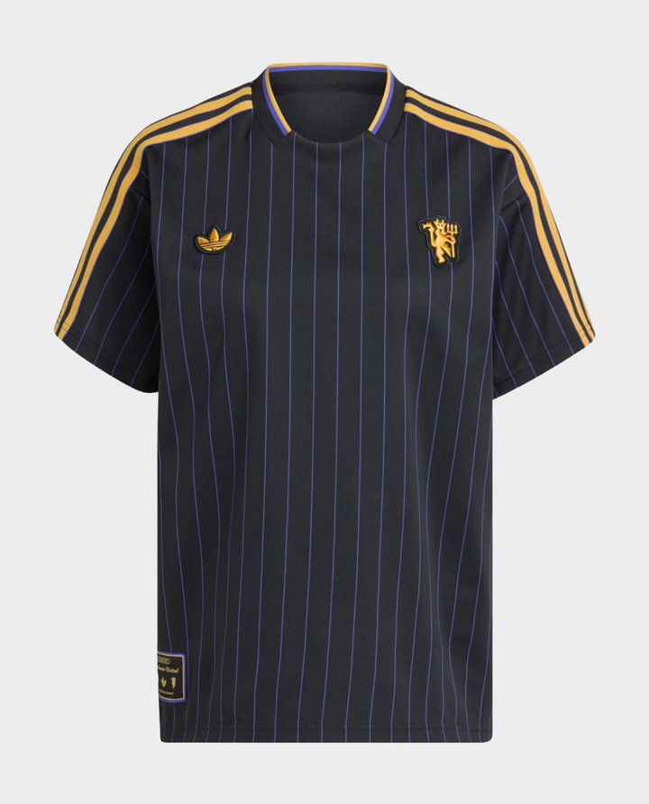 The Dribble Store Manchester United Terrace Icon jersey 2025-26 in navy with gold stripes and logo
