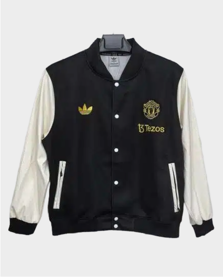 Stylish black Manchester United varsity jacket 2025-26 with gold accents and white sleeves