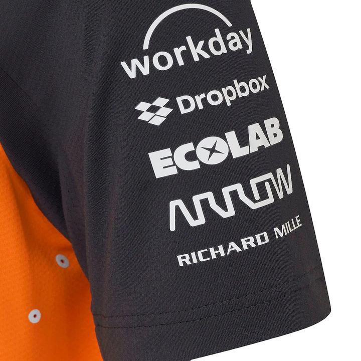 McLaren F1 racing 2025 team polo featuring sponsor logos on the sleeve