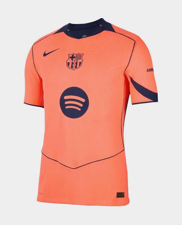 Barcelona third jersey 2025-26 player version coral orange Nike kit with navy accents FC Barcelona crest and Spotify logo