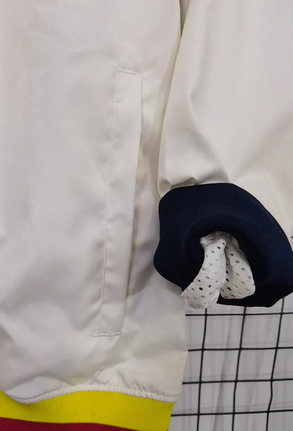 Barcelona windbreaker jacket 2025-26 with a white design and ribbed cuffs for a sporty look