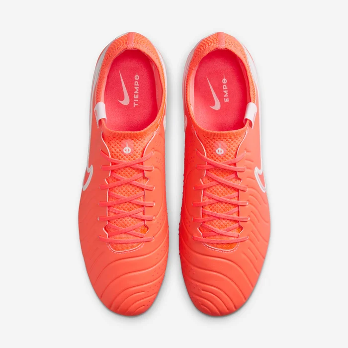 Bright orange Nike Tiempo Legend 10 Elite FG soccer cleats with lace-up design from The Dribble Store