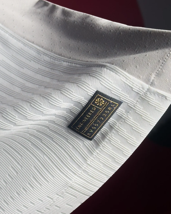 The Dribble Store close up of Tottenham Hotspur 2025 home jersey white fabric texture and woven label