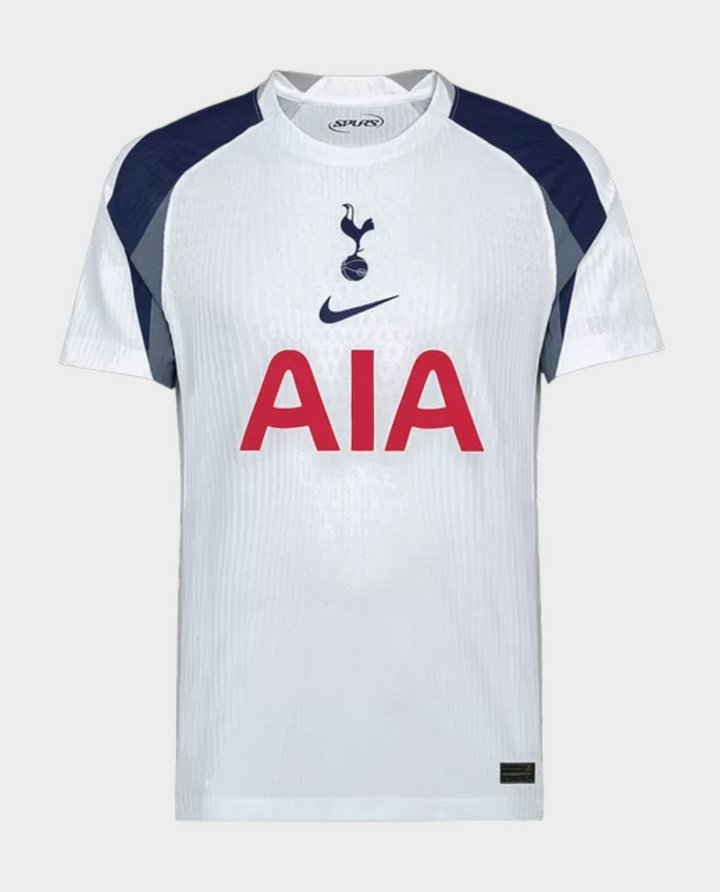 The Dribble Store Tottenham Hotspur 2025 home jersey white Nike shirt with navy shoulder panels and red AIA sponsor logo